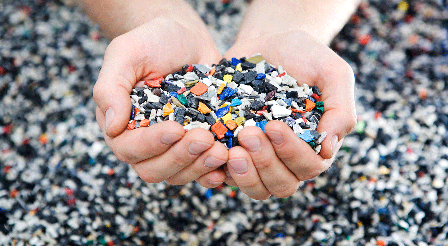 two-hands-holding-shredded-plastic-pieces.png